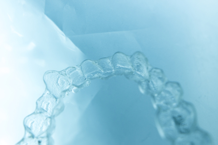 Invisible dental aligners plastic straighteners orthodontic brackets to align and straighten teeth.