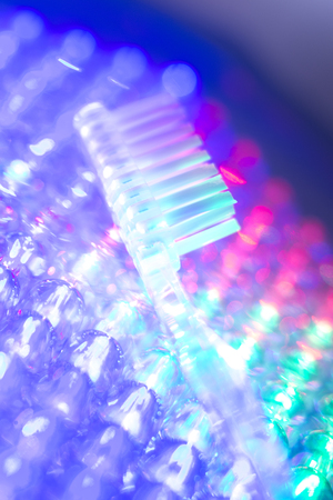 Dental toothbrush closeup isolated on abstract backgroundの写真素材