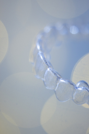 Teeth aligner invisible dentist retainer brackets to straighten teeth in cosmetic beauty dentistry dental treatment.の写真素材
