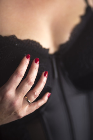 Busty slim sexy lady with very big erotic breasts and massive cleavage in lingerie underwear as glamor model.の写真素材