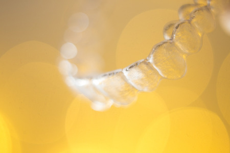 Teeth aligner invisible dentist retainer brackets to straighten teeth in cosmetic beauty dentistry dental treatment.の写真素材