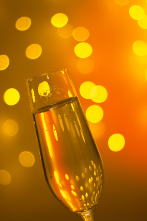 Champagne sparkling wine glass of prosecco cava in discotque party bar during wedding in Ibiza Spain with lights behind.の写真素材