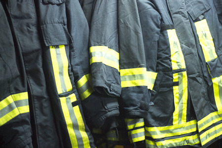 Fire station firefighter training equipment protective uniform used by fireman to fight fires and protect from flames.の写真素材