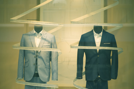 Tailor's shop window made to measure tailored suit store mannequin with formal shirt and tie with...