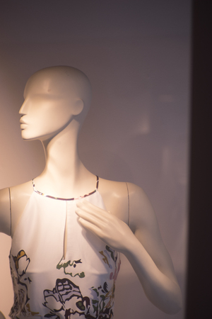 Womenswear fashion shop window ladies store mannquins dummies wearing fashionable modern clothes.の写真素材