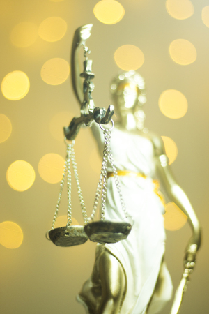 Lawyers legal office law statue representing blind justice courts figure with scales and swordの写真素材