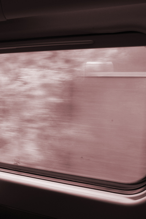 View from high speed train window in motion of countrysideand sky on sunny warm Spring day in Spainの写真素材