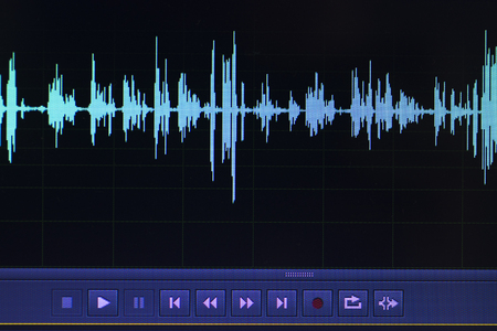 Audio sound wave studio editing computer program screen showings sounds on screen from vocal...