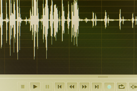 Audio sound wave studio editing computer program screen showings sounds on screen from vocal recording of voiceover.の写真素材