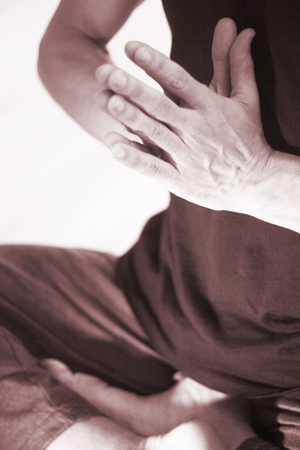 Yoga teacher man doing meditation practice with hand mudra asana.の写真素材
