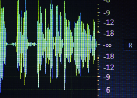 Audio sound wave studio editing computer program screen showings sounds on screen from vocal recording of voiceover.の写真素材