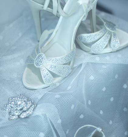 Bridal shop bride shoes with high heels in department store window.の写真素材