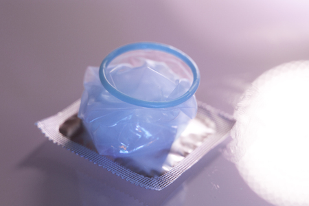 Rubber latex condom male contraceptive for safe disease and pregnancy free sex.の写真素材