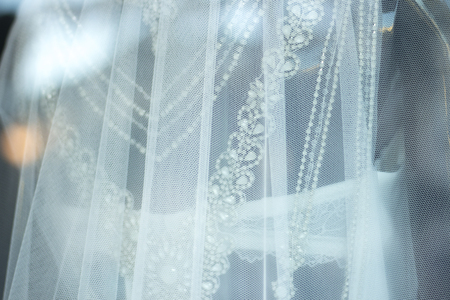 Bridal shop dummy bride mannequin in department store with white wedding dress.