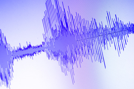 Audio sound wave studio editing computer program screen showings sounds on screen from vocal...