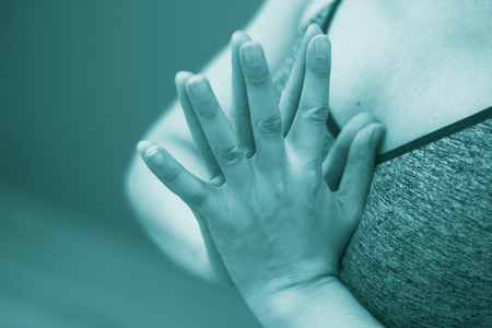 Female instructor yoga teacher teaching asana pose with mudra hand posture.の写真素材