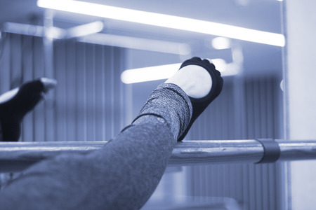 Pilates and ballet fitness stretching and yoga studio gym bar equipment and dancer stretching.の写真素材