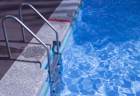 Summer outdoor swimming pool in luxury resort hotel garden.の写真素材