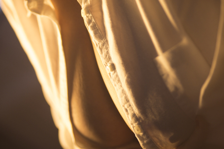 Busty slim sexy lady with very big erotic breasts and massive cleavage posing as adult model in photo shoot.の写真素材