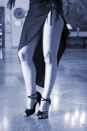 Ballroom latin salsa hot sexy female dancer dancing in modern sport dance showwith slim long legs,の写真素材