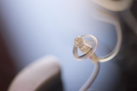 Audiophone modern high technology deafness equipment in the ear digital hearing aid closeup isolated.の写真素材