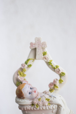 Cake topper Catholic holy baptism christening ceremony religious girl in Christian church.の写真素材