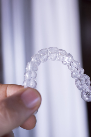 Invisible dental teeth aligners brackets used to align each tooth in cosmetic dentistry for...