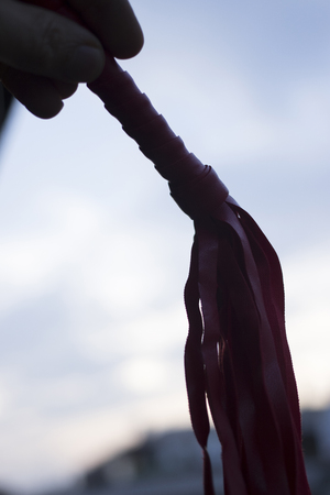 leather whip for adult kinky domination sex games.の写真素材