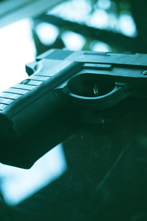 Automatic pistol handgun in artistic light effect moody atmospheric photo creative artistic.の写真素材