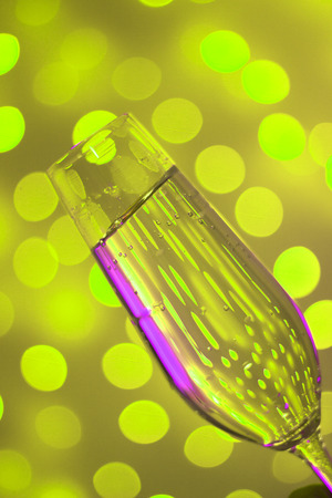 Champagne sparkling wine glass of prosecco cava in discotque party bar during wedding in Ibiza Spain with lights behind.の写真素材