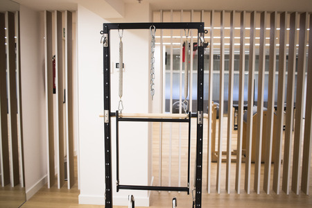 Pilates machine fitness studio gym room with training machines
