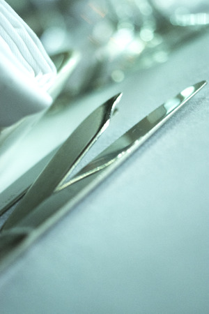 Wedding reception banquet dinner party table place settings set in luxury hotel venue.の写真素材