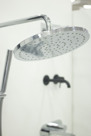 Bathroom chrome shower head showroom display of new design option for home building improvement.の写真素材