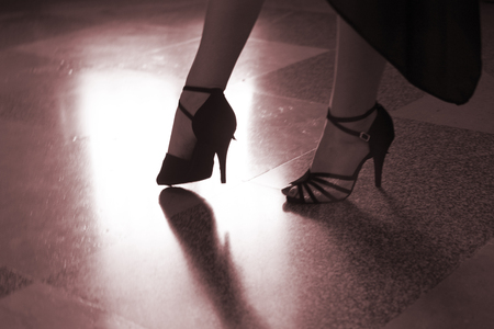 Ballroom latin salsa female dancer dancing in modern sport dance show in reception hall.の写真素材