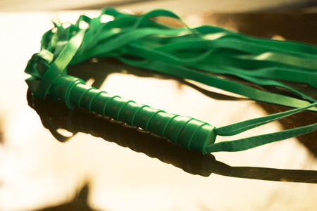 Bondage leather s&m whip for adult kinky domination sex games.