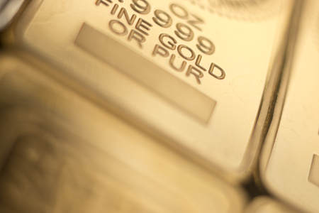 Gold bullion 999.9 purity solid one ounce ingot precious metal bars.の写真素材