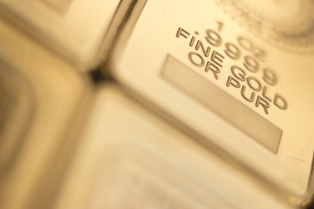 Gold bullion 999.9 purity solid one ounce ingot precious metal bars.の写真素材