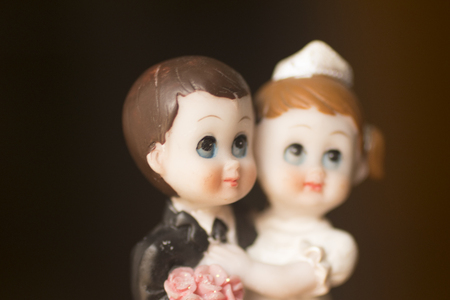 Cake topper Catholic holy communion ceremony religious boy and girl praying to Christian God in church.の写真素材