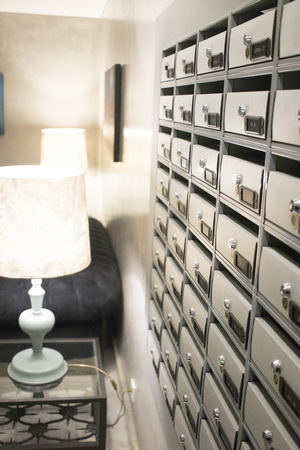 Residential appartment block building interior letter boxes with numbers.の写真素材