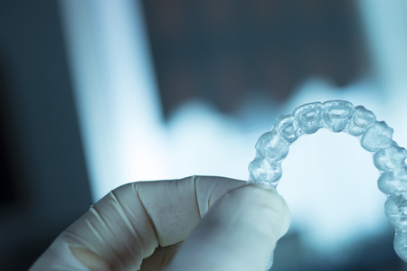 Invisible dental teeth aligners brackets used to align each tooth in cosmetic dentistry for...