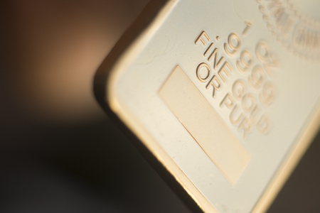 Gold bullion 999.9 purity solid one ounce ingot precious metal bars.の写真素材