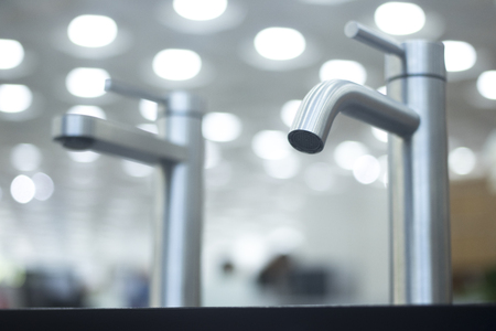 Bathroom tap sink showroom display of new design option for home building improvement works.