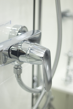 Bathroom shower head showroom display of new design option for home building improvement.の写真素材