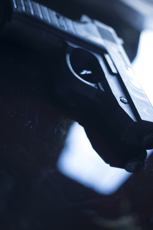 Automatic pistol handgun in artistic light effect moody atmospheric creative artistic closeupの写真素材