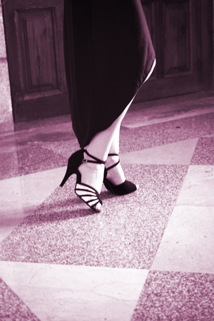 female dancer dancing in modern sport dance showwith slim long legsの写真素材