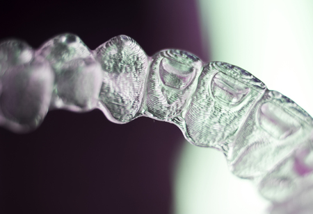Invisible dental teeth aligners brackets used to align each tooth in cosmetic dentistry for...