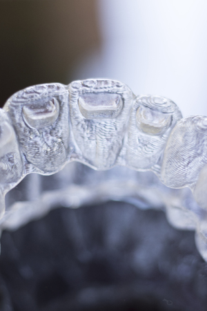 Invisible dental teeth aligners brackets used to align each tooth in cosmetic dentistry for...
