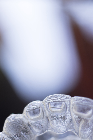 Invisible dental teeth aligners brackets used to align each tooth in cosmetic dentistry for...
