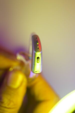 Modern digital hearing aid for deafness and deaf people.