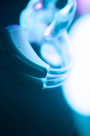 Modern digital hearing aid for deafness and deaf people.